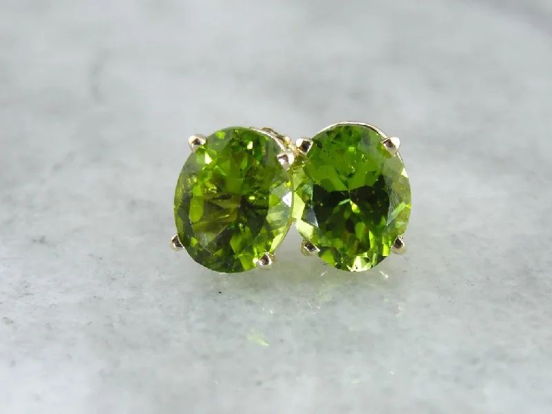 Ladies earrings designer labels-Large Oval Peridot Stud Earrings in Yellow Gold