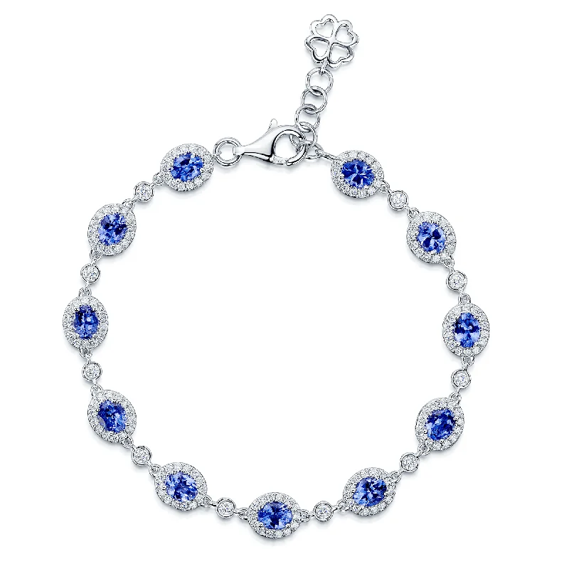 Ladies bracelets wedding wear-18ct White Gold Oval Tanzanite And Diamond Cluster Bracelet