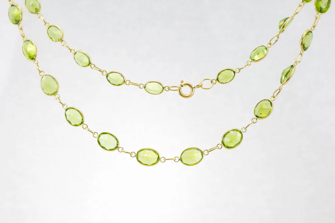 Ladies necklaces silver finishes-9ct Yellow Gold Peridot Graduated Line Necklace