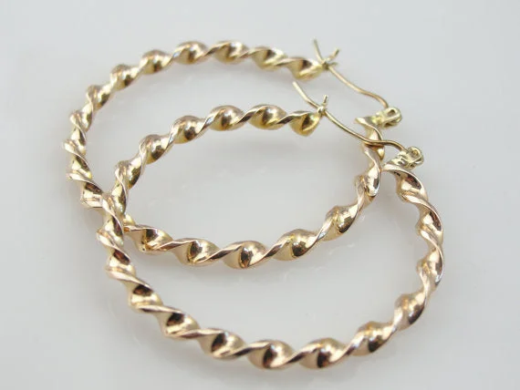 Ladies earrings vintage appeal-Fabulous Twist Vintage Yellow Gold Hoop Earrings