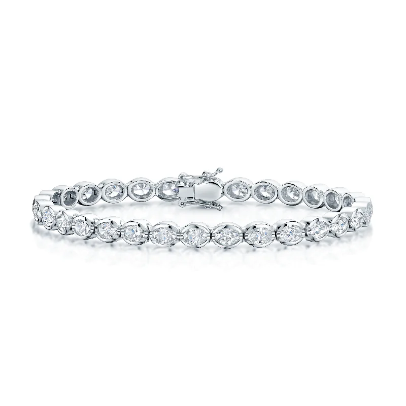 Ladies bracelets personalized-18ct White Gold Oval Cut Diamond Rub Over Set Tennis Bracelet