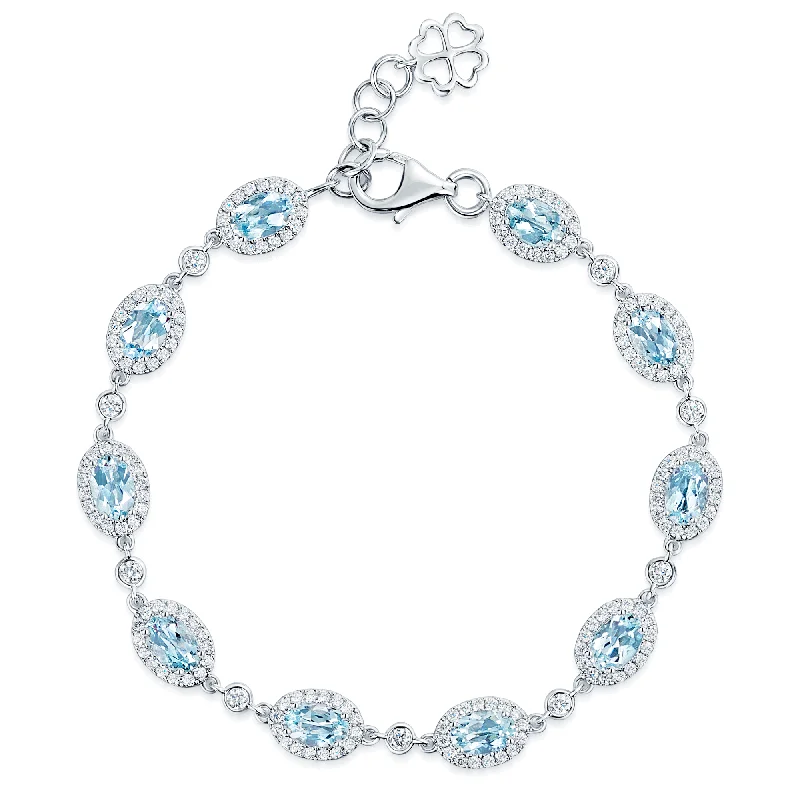 Ladies bracelets floral designs-18ct White Gold Oval Cut Aquamarine And Diamond Halo Surround Bracelet