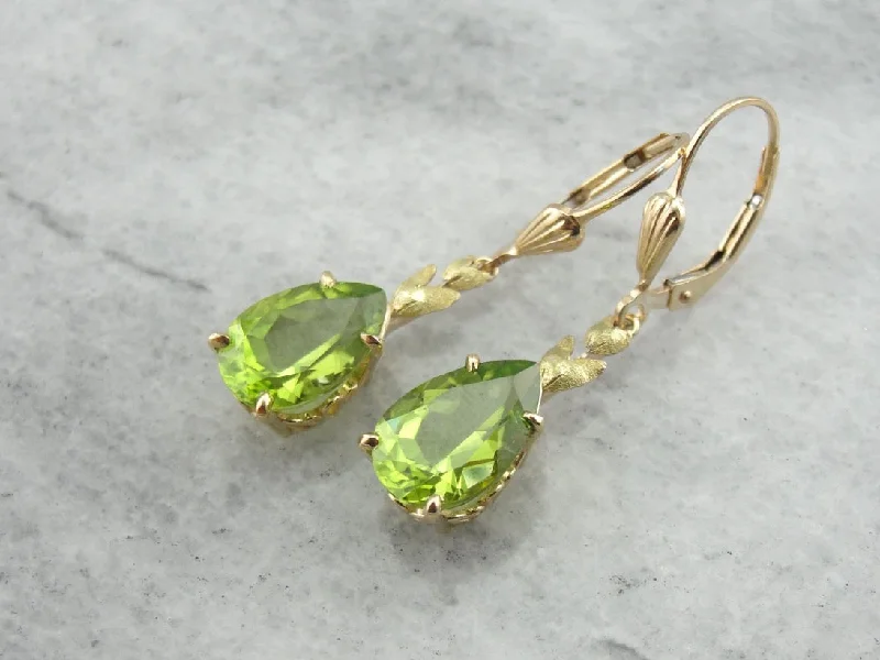 Ladies earrings minimalist charm-Perfect Green Drops: Peridot Drop Earrings with Leaf Motif Accent