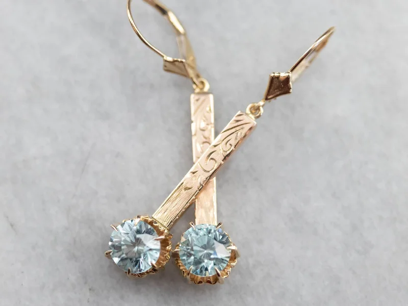 Ladies earrings bold statements-Blue Zircon Ornate Gold Bar Drop Earrings