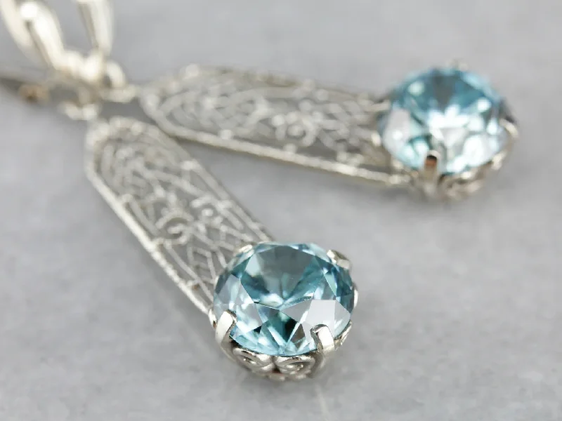 Ladies earrings care advice-Blue Zircon Filigree Drop Earrings in White Gold with Leverbacks